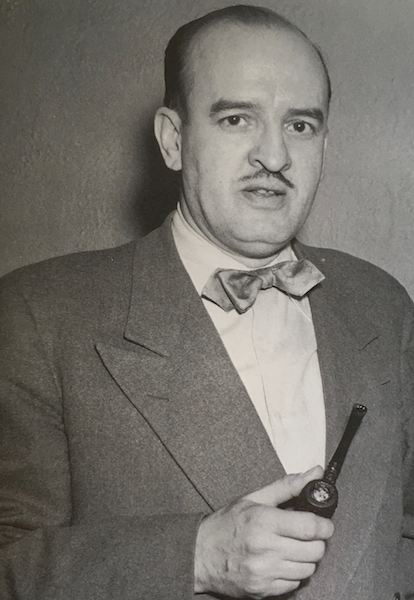 A.E. Fulford holding a pipe