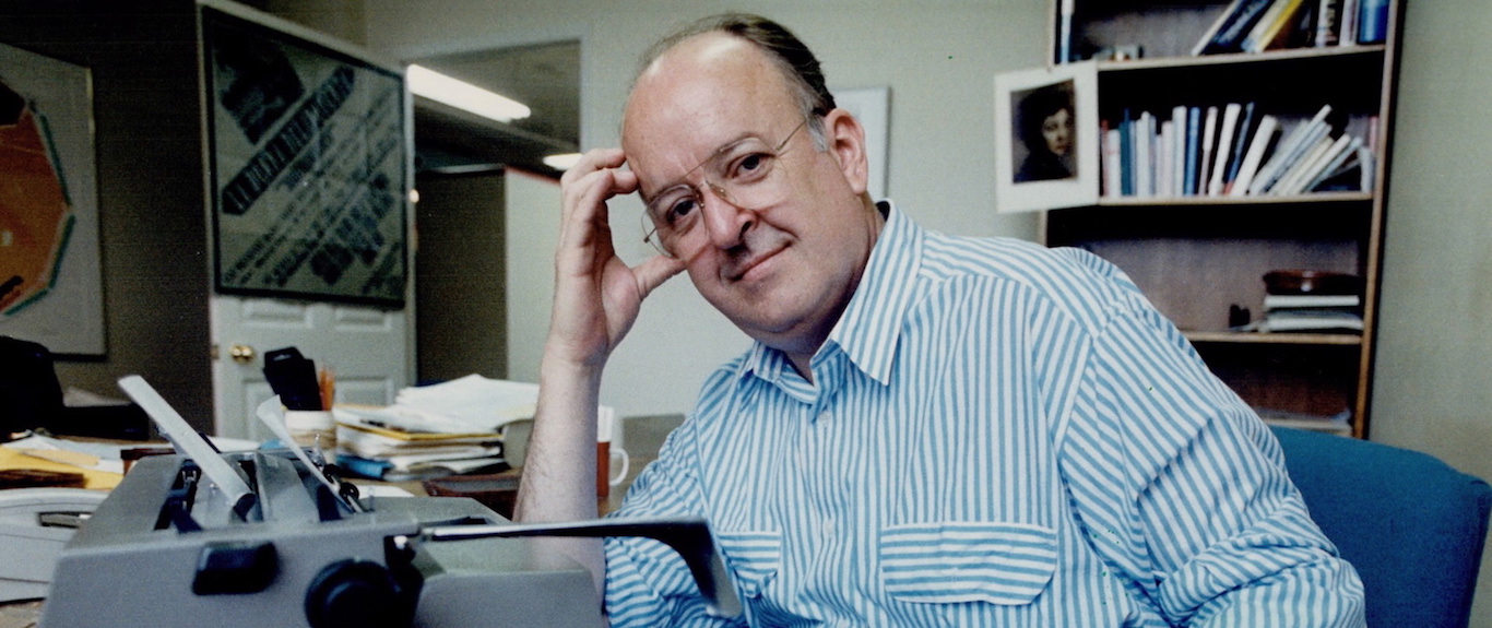 Robert Fulford at desk with typewriter